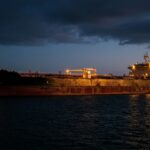 Crude oil supertanker anchored motionless in the Persian Gulf during the 2026 Strait of Hormuz crisis